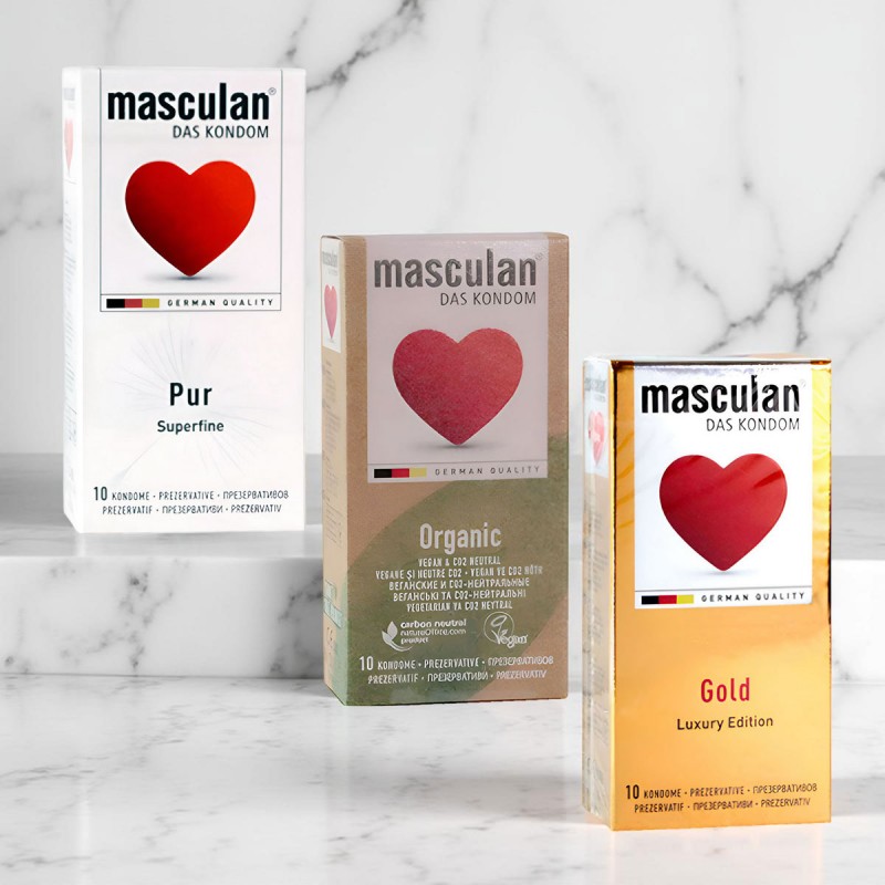 Три коробки презервативов Masculan Premium с разным цветом упаковки, надписи на русском