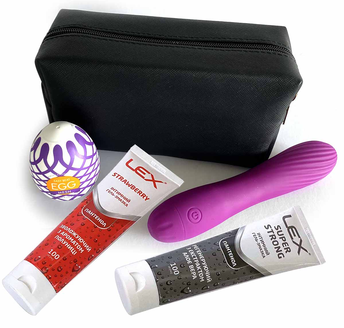 Рожева косметичка з прозорим віконцем, всередині вібратор, яйце та змазки