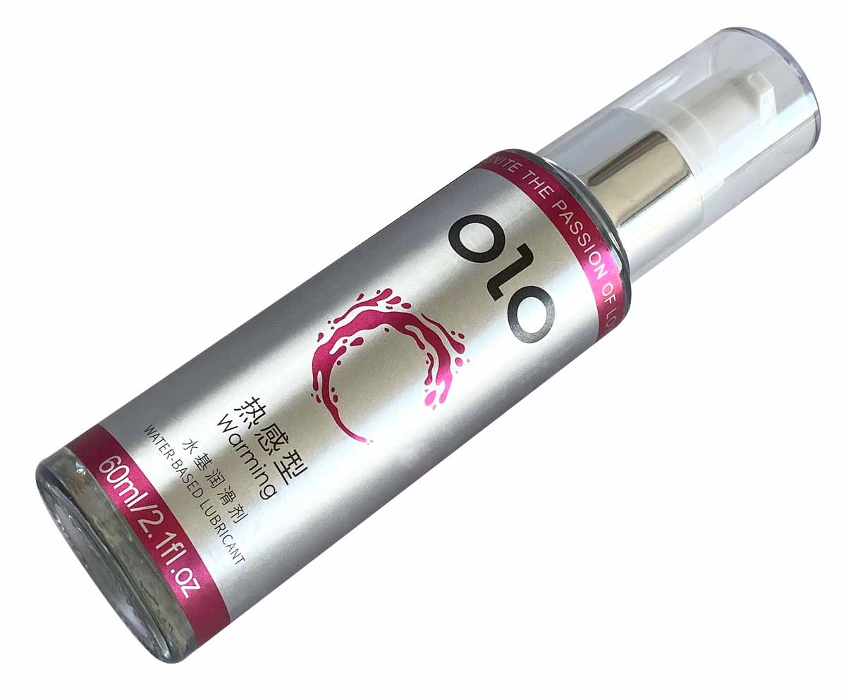 Прозрачный флакон с оранжевой крышкой и надписью OLO Warming 60 мл