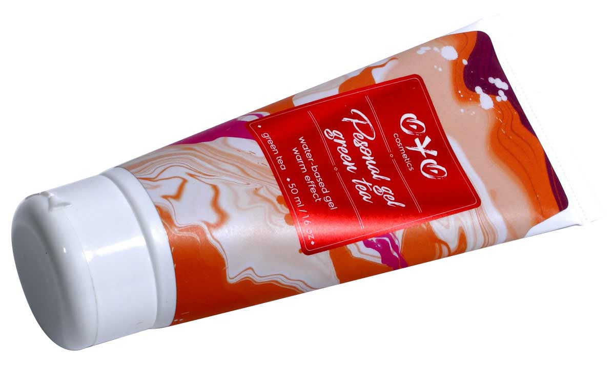 Зеленый флакон OYO Personal gel Green Tea 50мл с белой крышкой и надписью warming